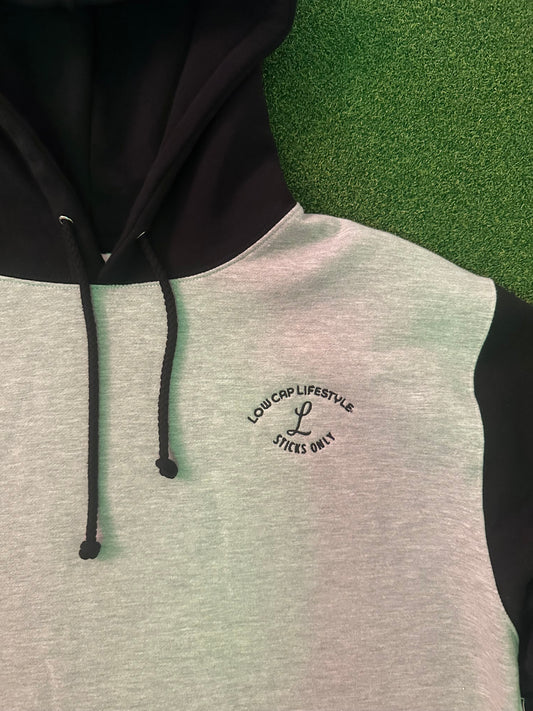 2 tone Heavy weight slotter hoodie. Close up of small logo on chest that says Low Cap Lifestyle Sticks Only