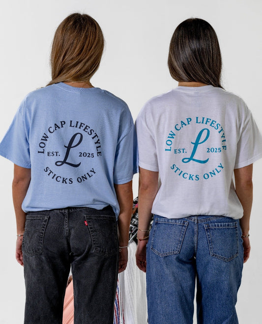 Two people wearing the liquid Nail Gun  t-shirts with 'Low Cap Lifestyle' text on the back, standing side by side.