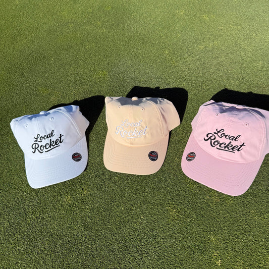 3 local rocket hats on the grass 
