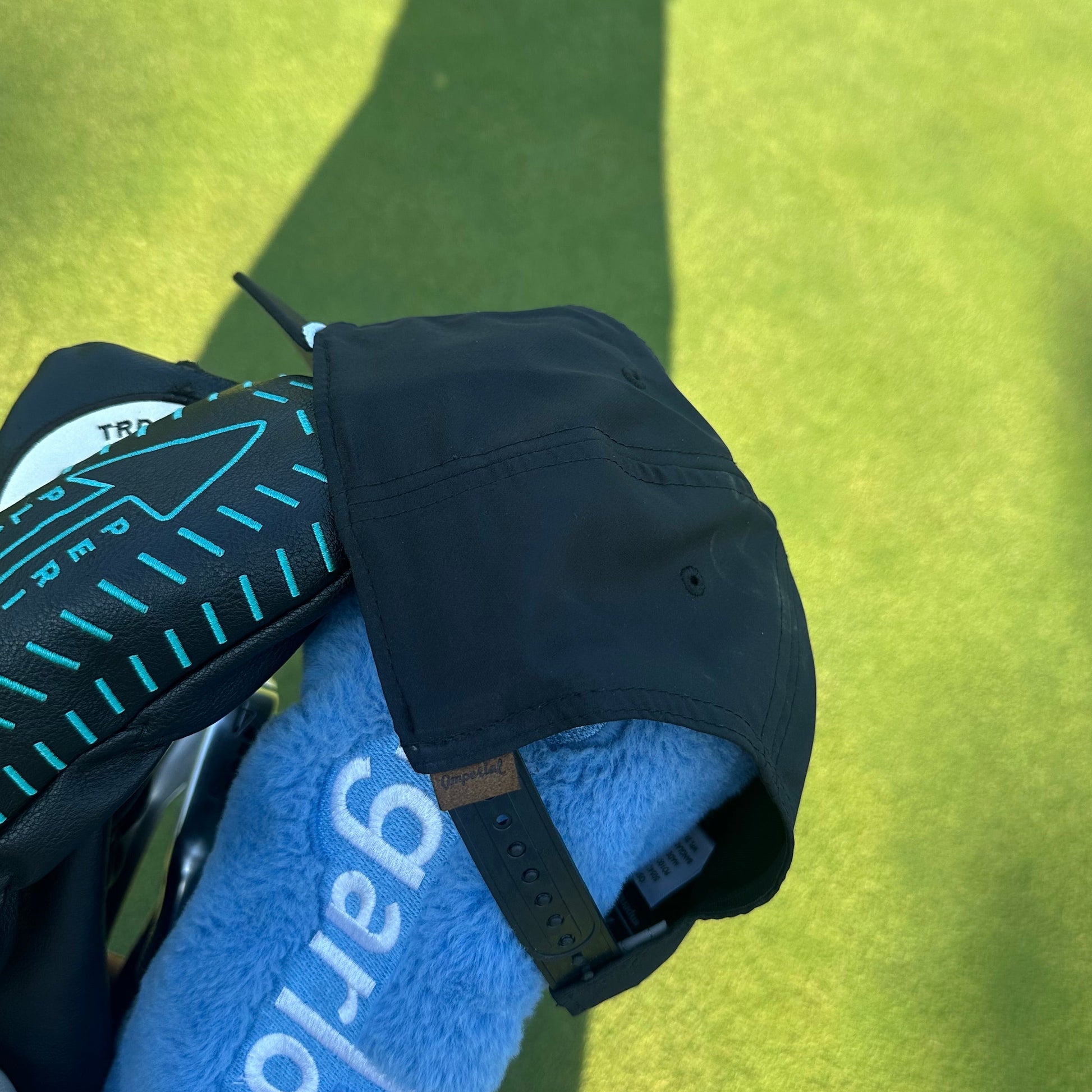 Back of the black slotted cash piece hat 