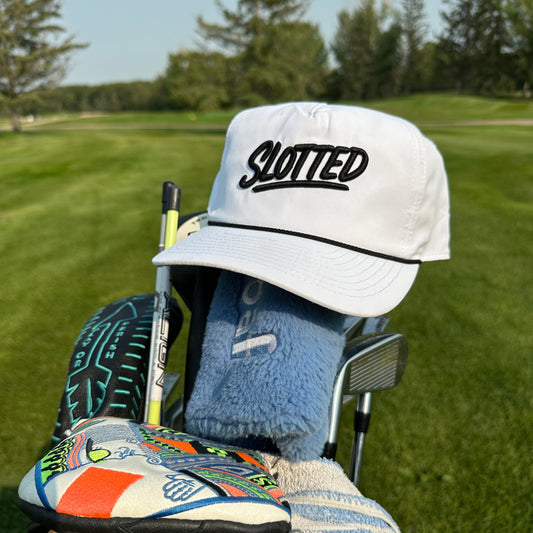 Slotted Cash piece hat. White with black embroidery 